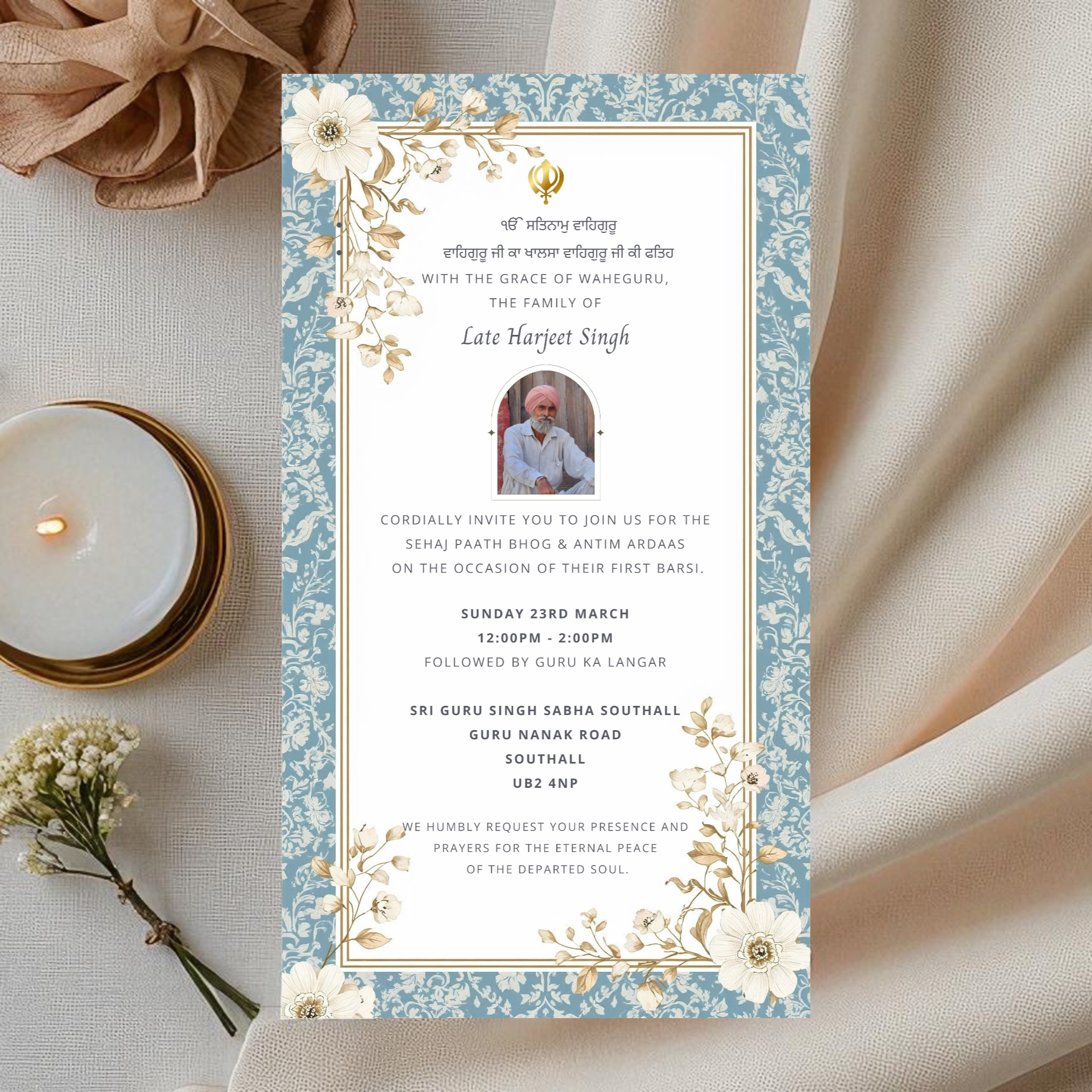 Barsi in Memory invitation card with floral design on a light fabric background