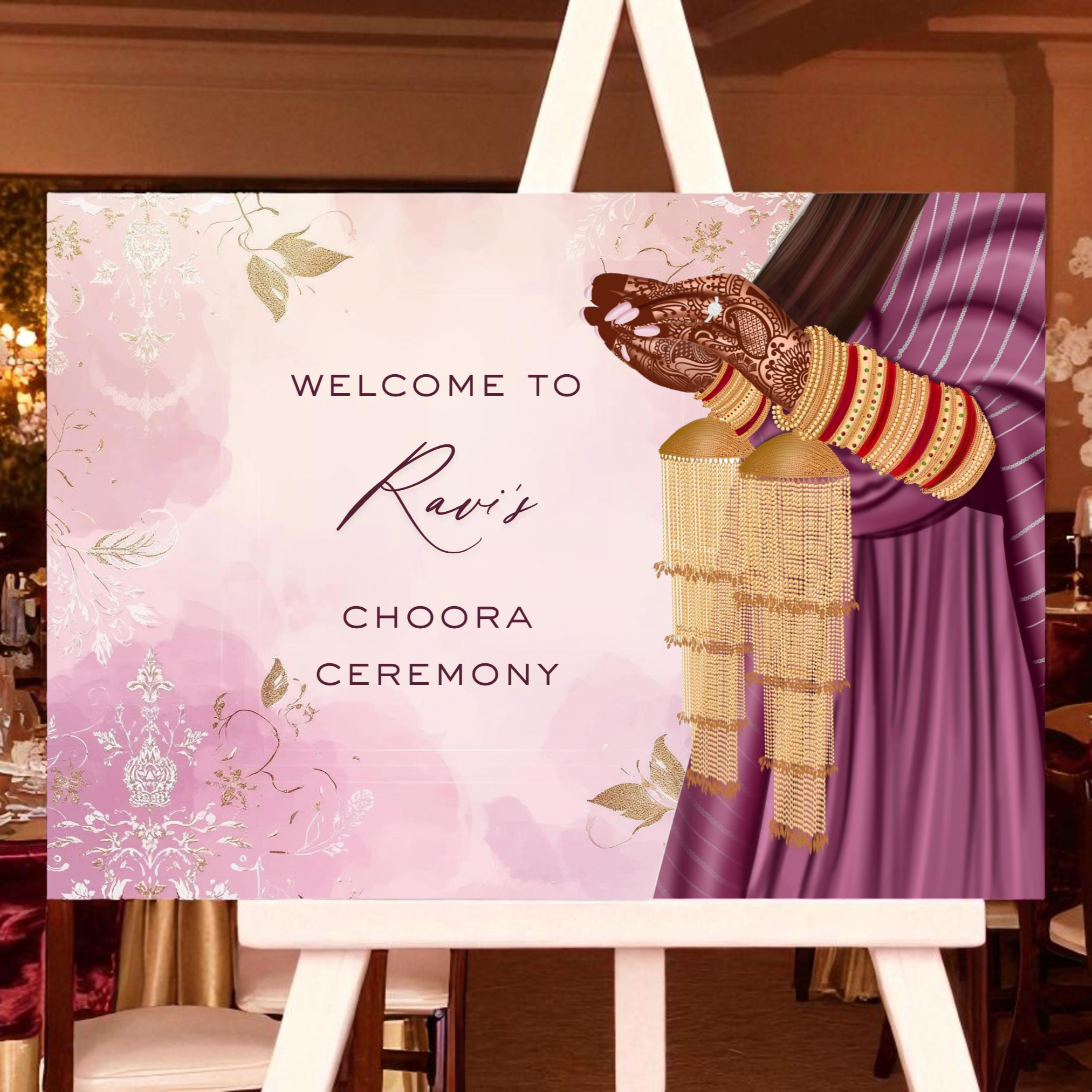 Decorative sign for a Ravi's Choora Ceremony event with floral design and traditional attire on an easel.