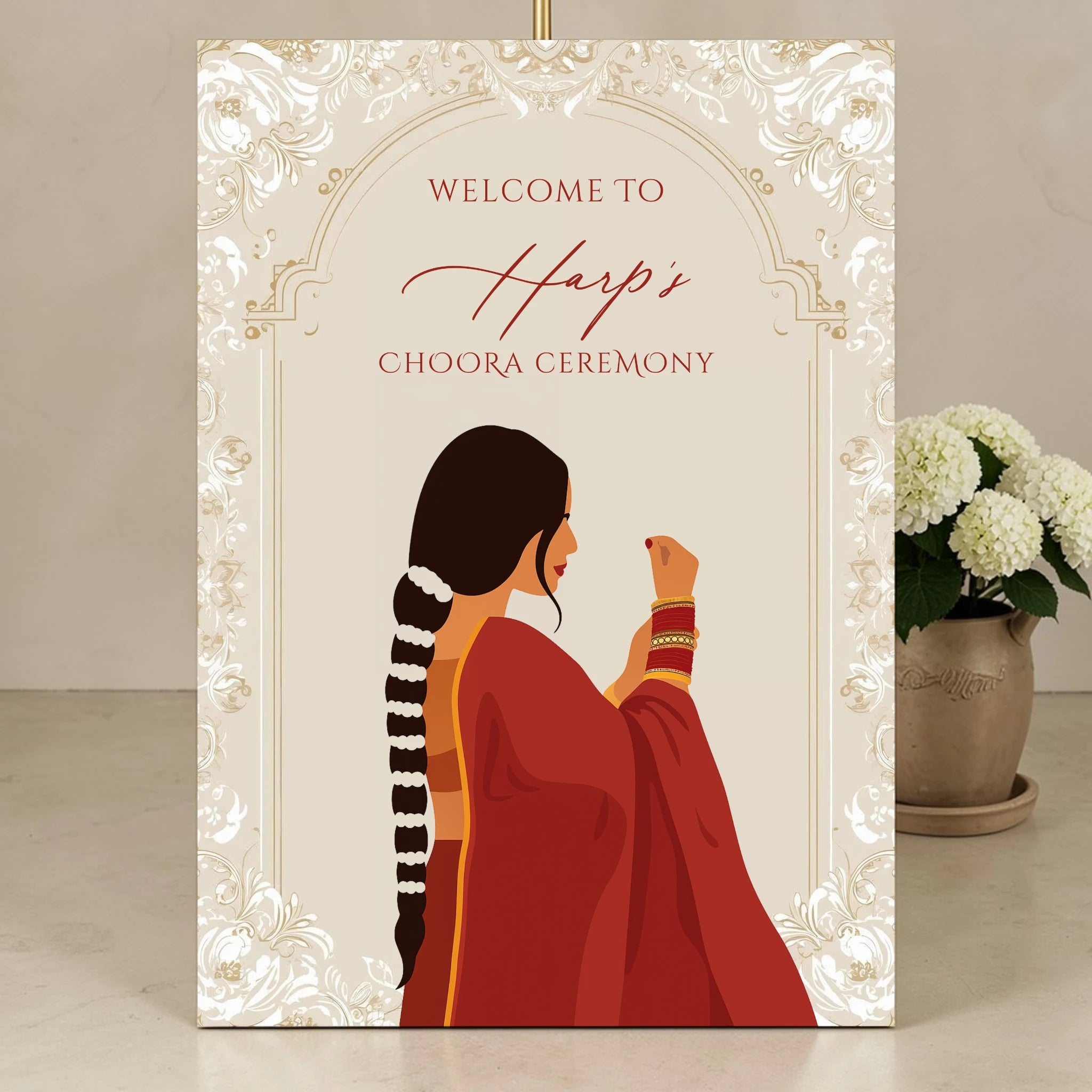 Personalised Choora ceremony welcome sign on 3mm foamex featuring illustrated Indian bride in red suit with choora bangles and floral braid set against ivory gold ornate arch border
