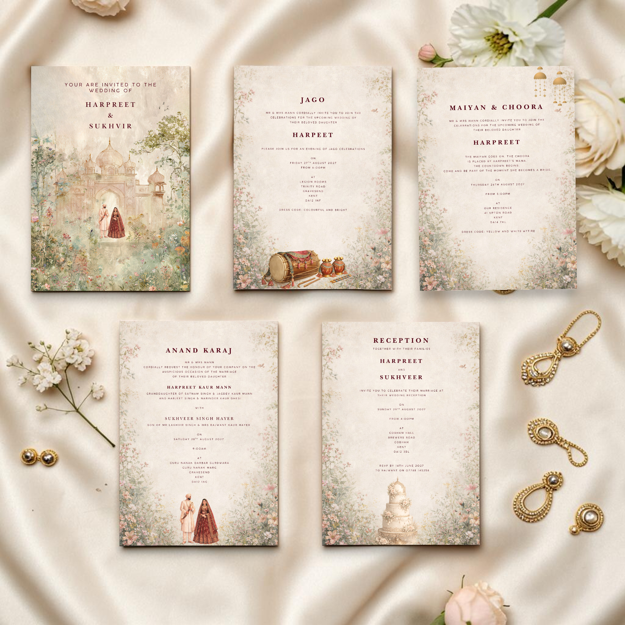 All five pages of a Punjabi Sikh digital wedding invitation suite laid out on cream silk fabric with white flowers, pearl earrings and gold jewellery props, showing watercolour Mughal palace cover page, Jago insert with dhol illustration, Maiyan and Choora insert with gold kalire, Anand Karaj insert with couple illustration and reception insert with wedding cake by Krafty Kaur