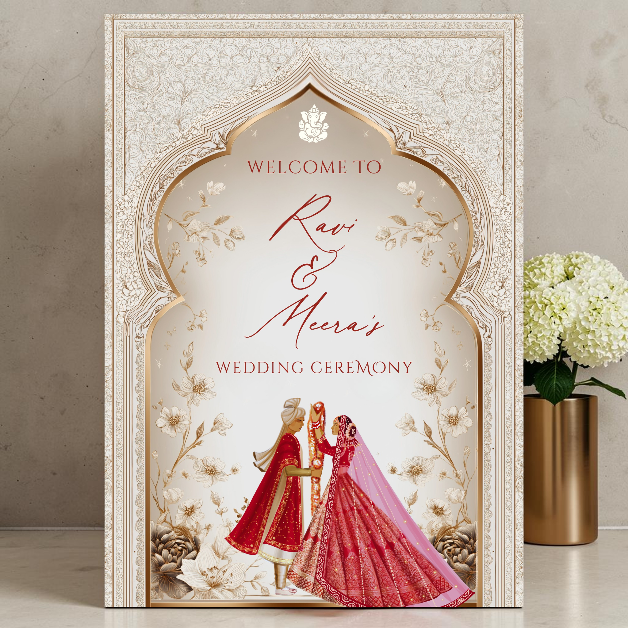Personalised Hindu wedding welcome sign printed on 3mm foamex featuring Ganesha symbol, illustrated bride in red lehenga and groom in red sherwani beneath ornate ivory and gold Mughal arch with delicate floral linework