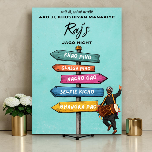 Personalised Jago Night welcome sign printed on 3mm foamex. Bright turquoise background with illustrated Punjabi dhol player in black kurta and turban. Colourful wooden directional signpost with Khao Piyo, Glassy Piyo, Nacho Gao, Selfie Kicho, Bhangra Pao arrows. Custom name and Gurmukhi greeting. A1 or A2. By Krafty Kaur.