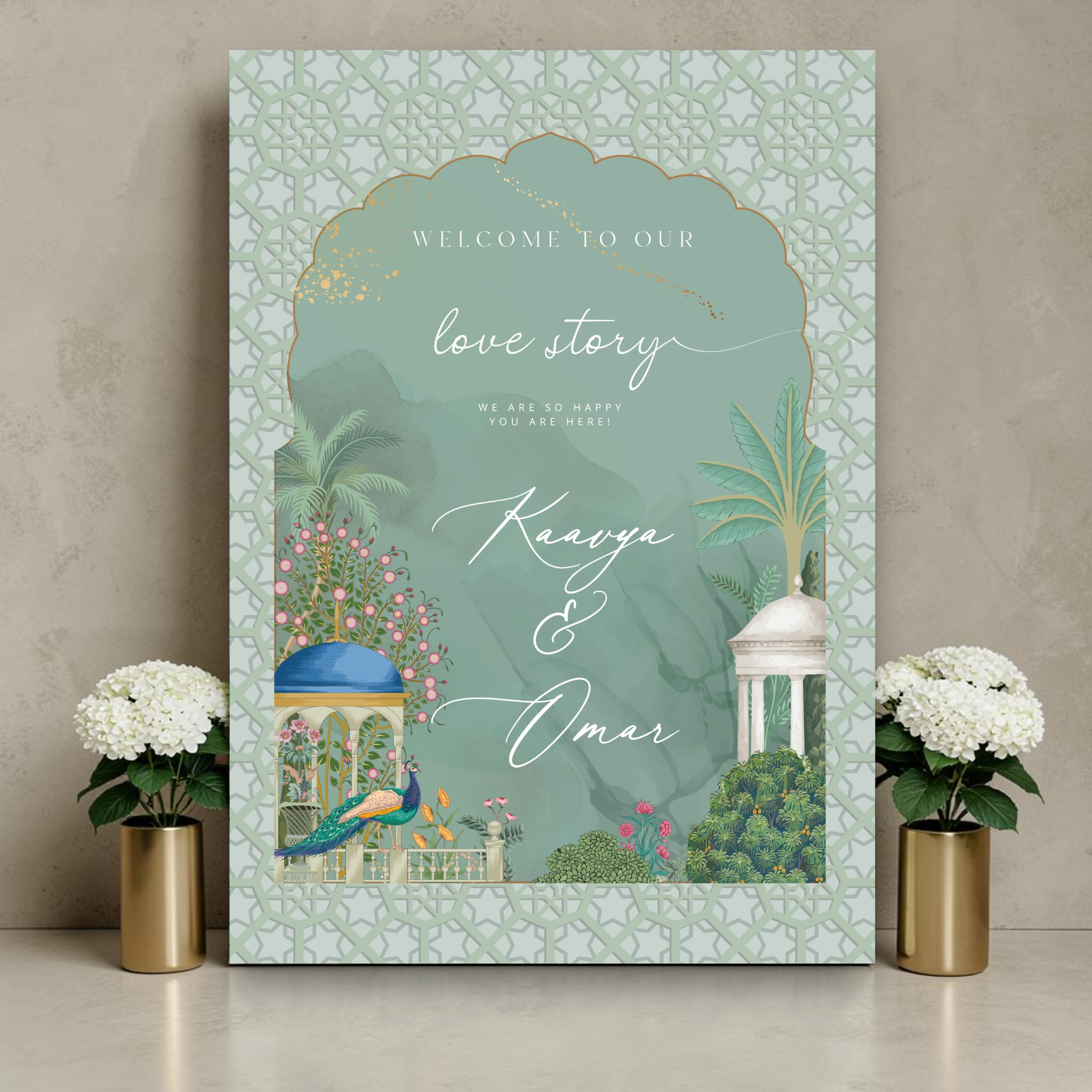 Indian wedding welcome sign on a gold easel flanked by a bare branch vase and white hydrangeas, featuring a Mughal garden arch with blue-domed pavilion, peacock, white gazebo, tropical palms and pink florals in sage green watercolour with gold detail and Moroccan lattice border, reading "Welcome to our love story — Kaavya and Omar"