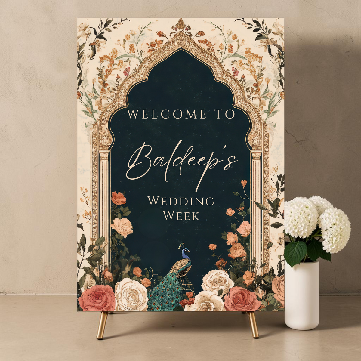Personalised Indian wedding week welcome sign printed on 3mm foamex. Dark teal Mughal arch on cream vintage floral background with terracotta, blush and ivory roses, peacock and warm gold botanicals. Custom name in cream script and wedding week text. A1 or A2. By Krafty Kaur.