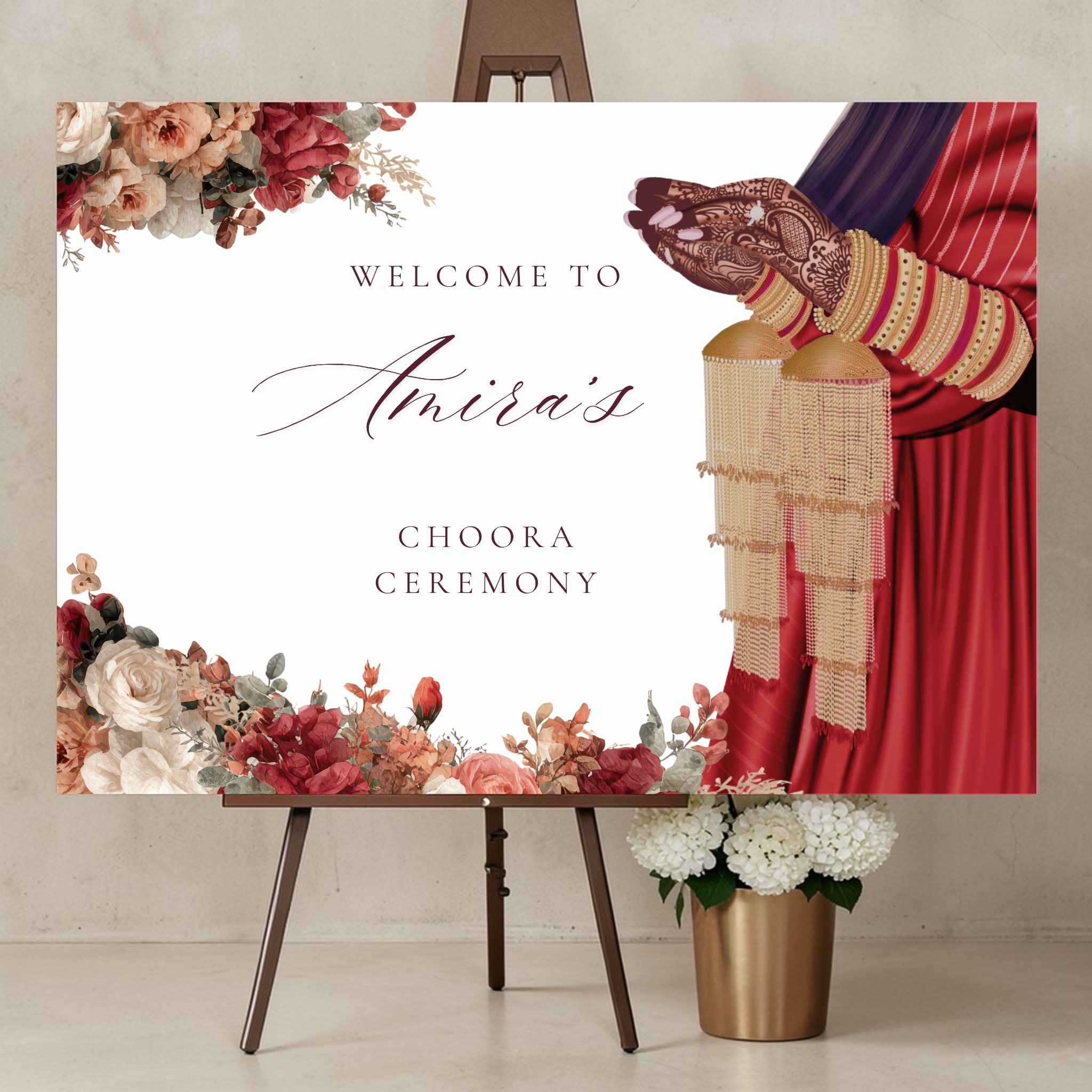 Personalised Choora ceremony welcome sign printed on 3mm foamex board, displayed on gold easel, featuring illustrated Indian bride with mehndi hands, choora bangles and red watercolour florals