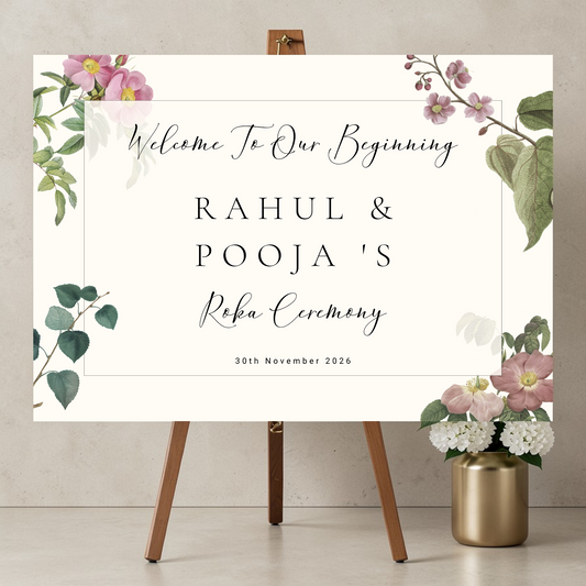 Personalised Roka Ceremony welcome sign printed on 3mm Foamex 
on a wooden easel, soft pink botanical wild roses and eucalyptus 
on warm ivory background, custom names Rahul and Pooja in elegant 
spaced serif and calligraphy typography, A1 landscape format