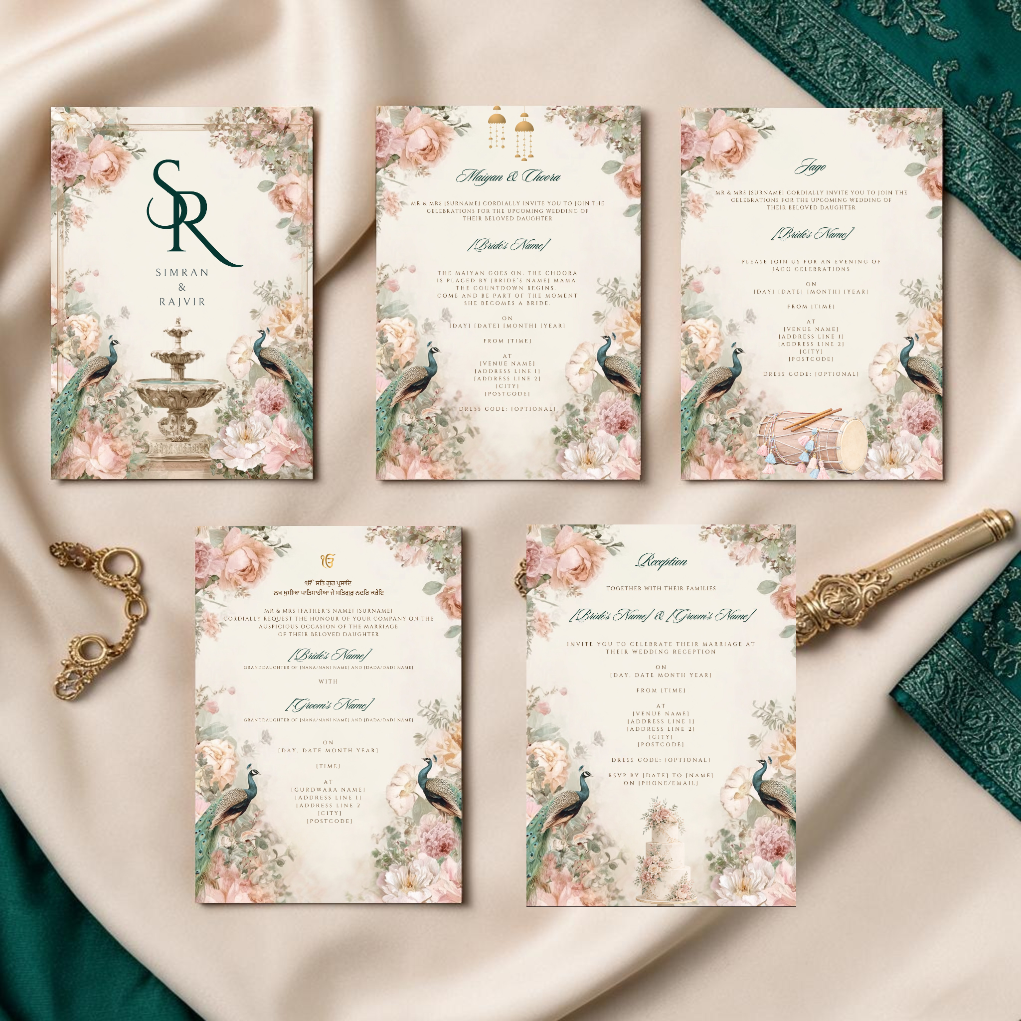 Sikh wedding stationery suite on an ornate gold tray showing Anand Karaj invite with Ik Onkar symbol, Gurmukhi scripture and peacock botanical design