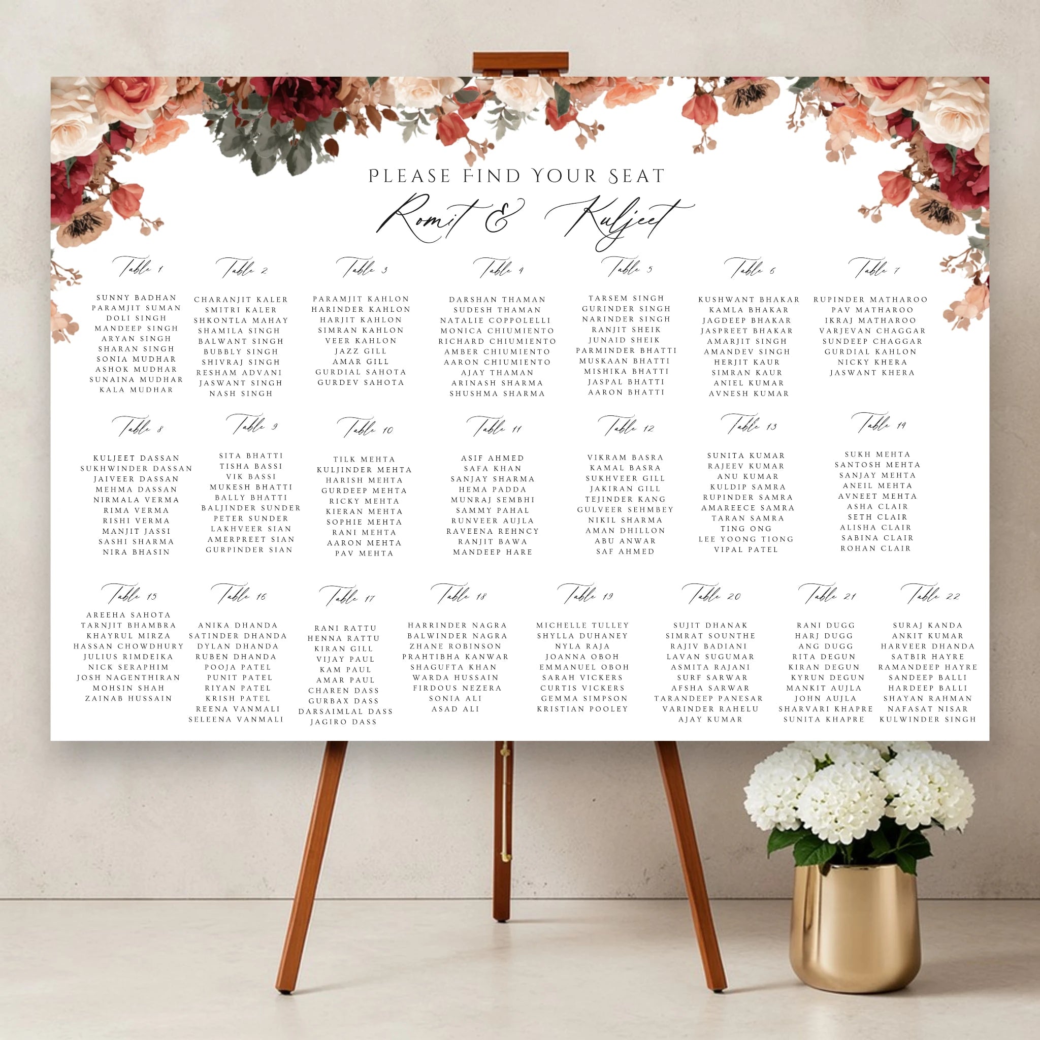 floral Indian wedding seating plan board with romantic peach and burgundy flowers personalised Asian wedding table plan